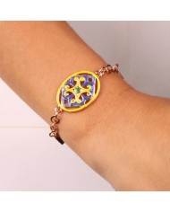 Bracciale in Metallo cristalli bianchi con dettaglio centrale in maiolica a fiore smaltata blu e giallo